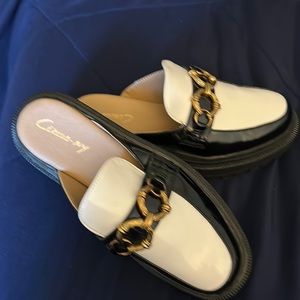 White and black Spectator Circus Mules. Size 7.5. Never worn. Great condition!!